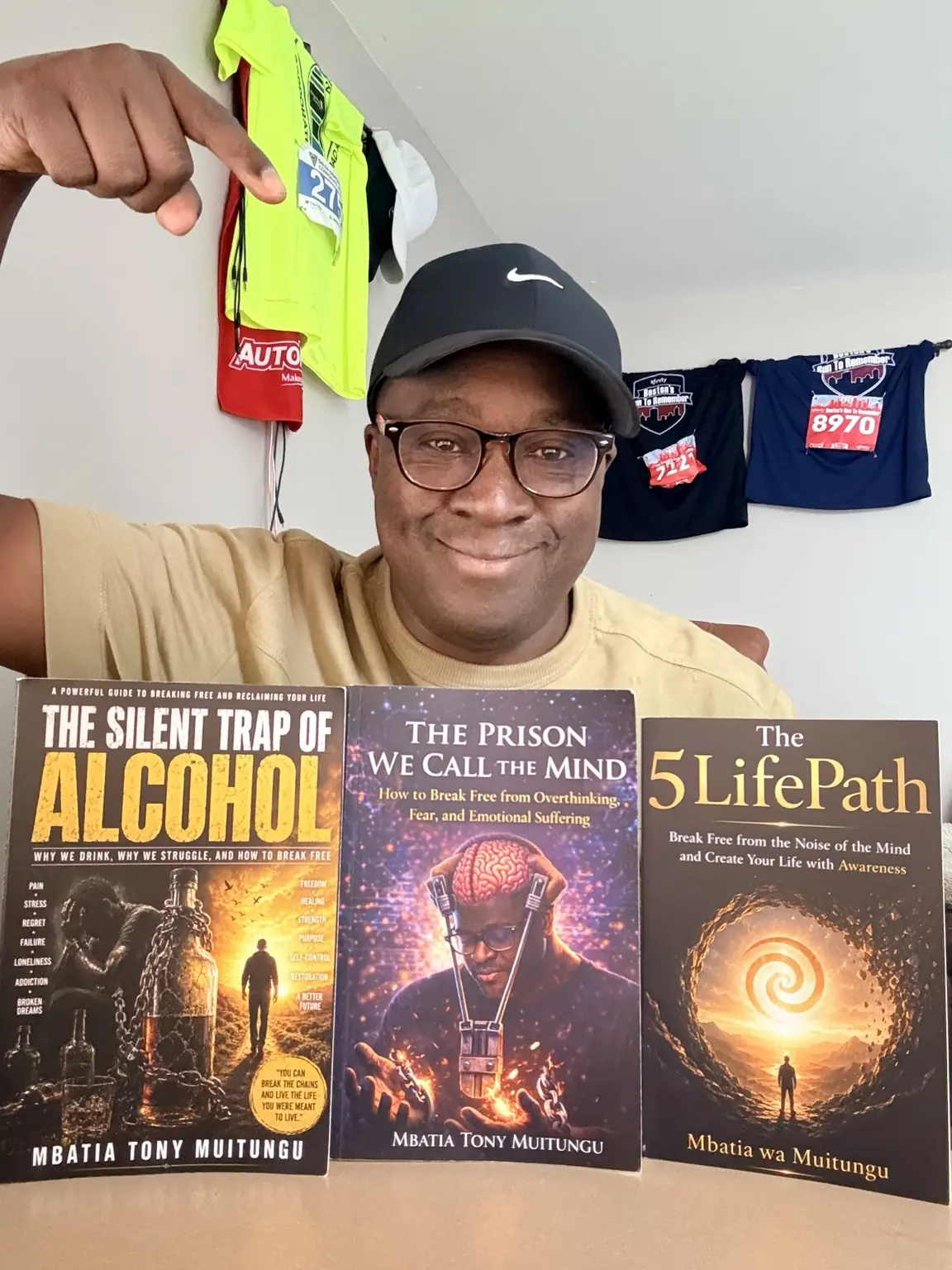 Mbatia Tony Muitungu with his three published books